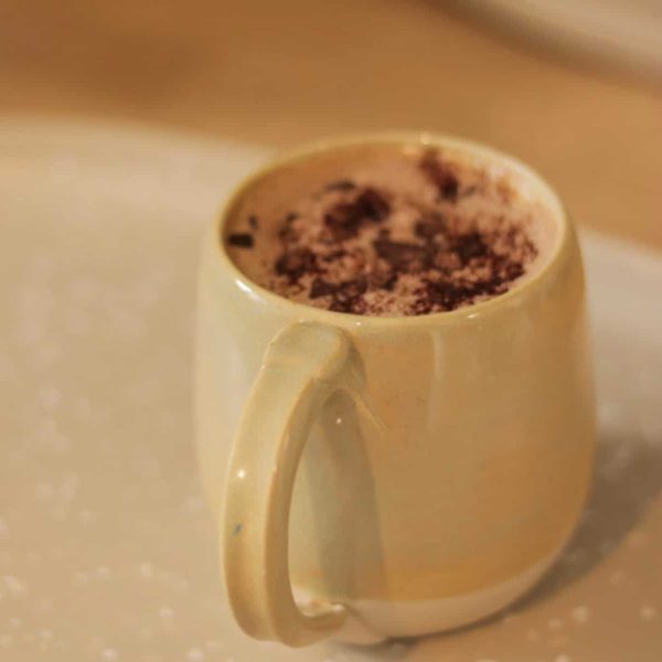 The West Gate Gallery Yellow stoneware mug with handle made by Mena